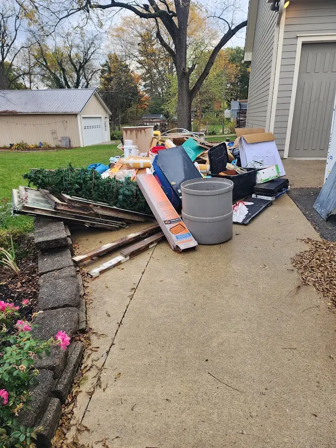 Dumpster being loaded with debris for 10 Yard Dumpster Rental in Glasgow